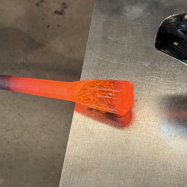 Close-up of a hot glass gather fresh from the furnace